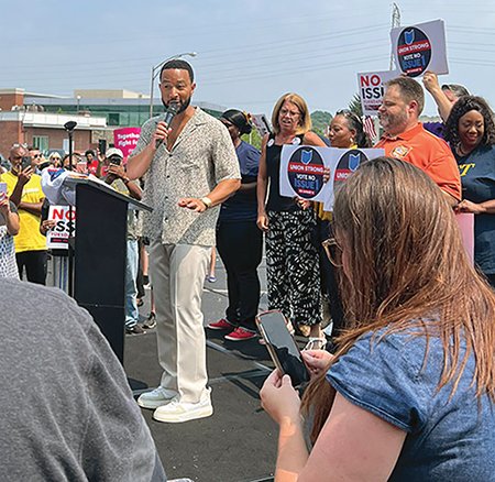 Singer-songwriter John Legend addresses a crowd at a political rally in Ohio